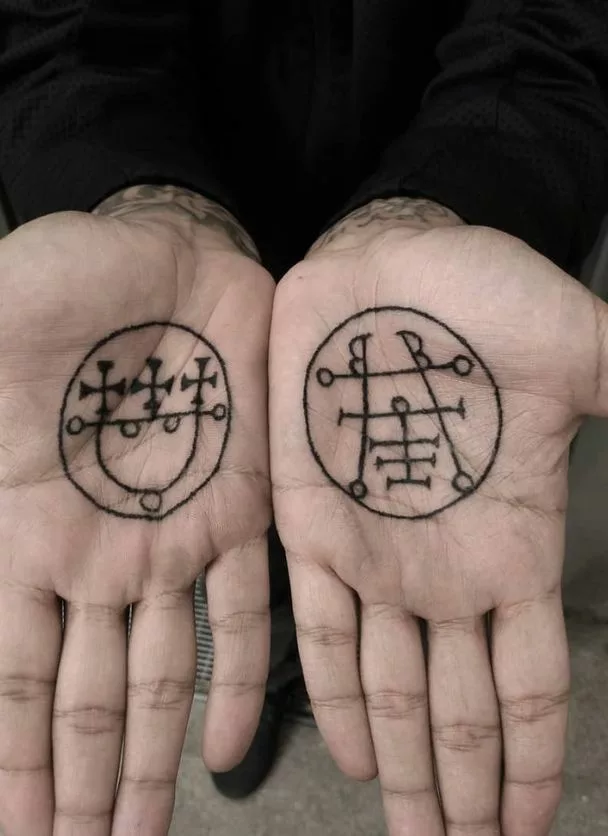 sigil tattoos At hands