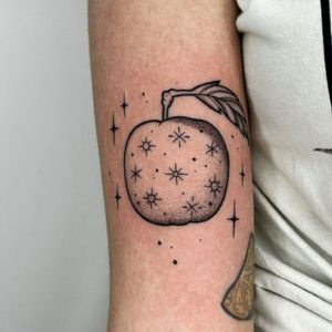 black and grey apple tattoo