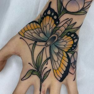 color butterfly hand tattoo