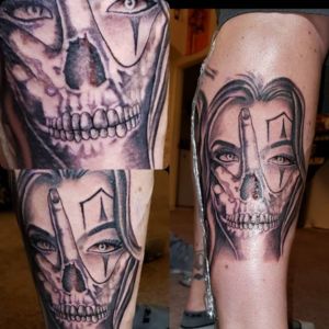 female skull hand tattoo