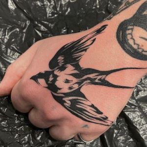 hand swallow tattoo