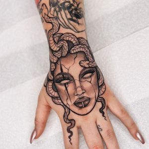 realistic medusa hand tattoo