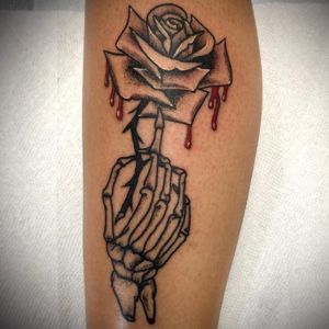rose skeleton hand tattoo