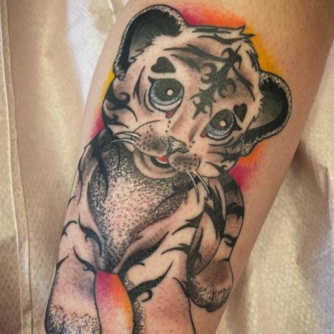 cartoon baby snow leopard tattoo