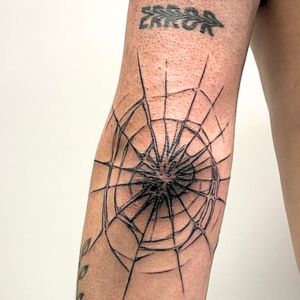 distorted web tattoo
