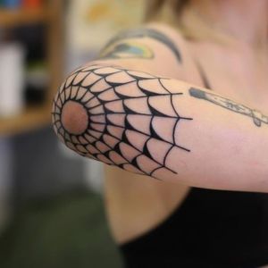 female spider web tattoo