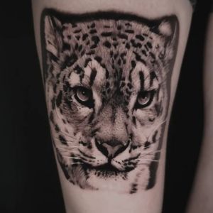realistic snow leopard tattoo black