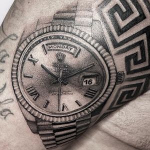versace and Rolex tattoo