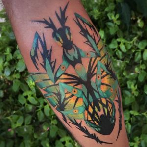 Mantis Arm Colorful Tattoos On Dark Skin