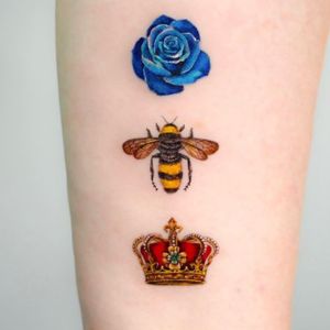 bee and blue flower tattoo