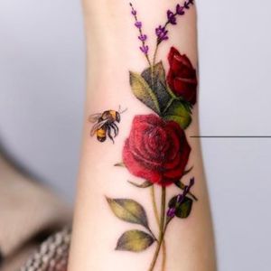 bee and red flower tattoo