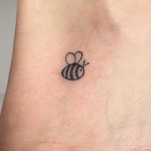 black minimal bee tattoo