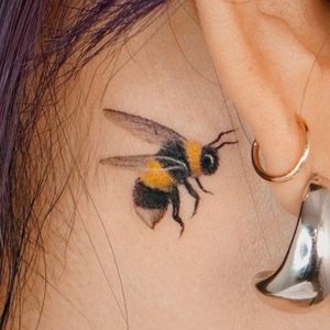 ear realistic bee tattoo
